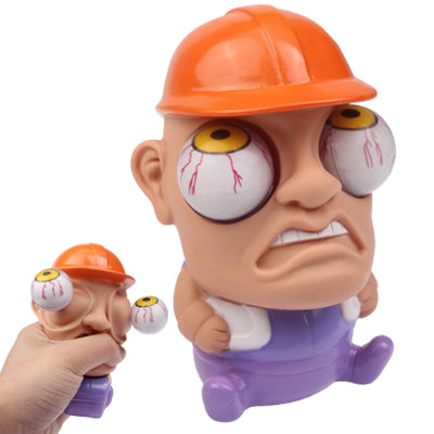 Orange hard-hat cartoon character toy with purple body, holding small toy in hand.