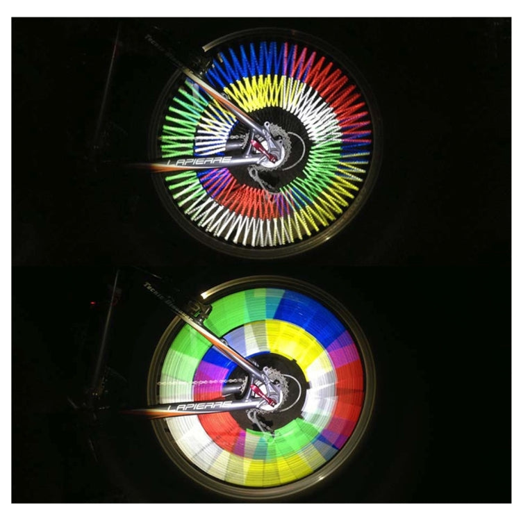Bicycle wheel with multicolor reflective spokes, bright circular glow effect