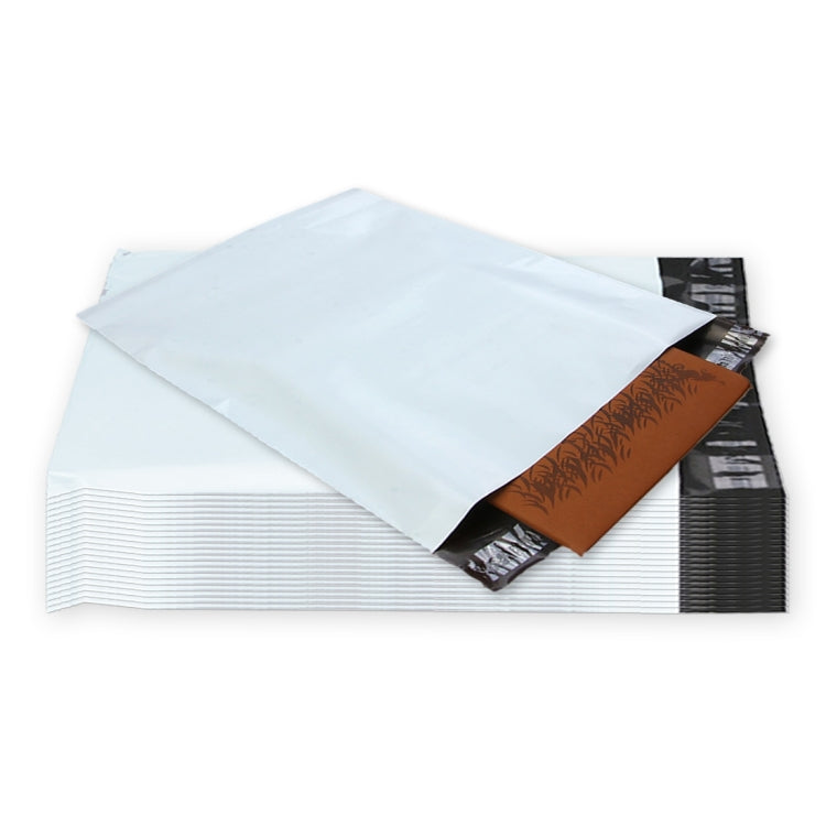 White padded shipping mailers with dark backing and a brown card insert