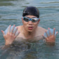 Person wearing light blue silicone webbed swimming gloves with finger paddle fins