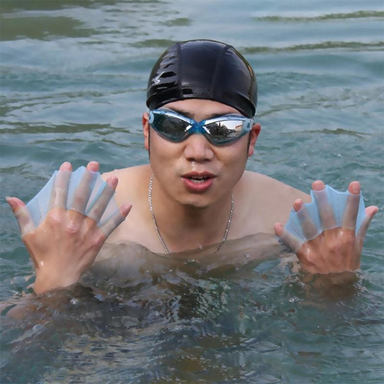 Person wearing light blue silicone webbed swimming gloves with finger paddle fins