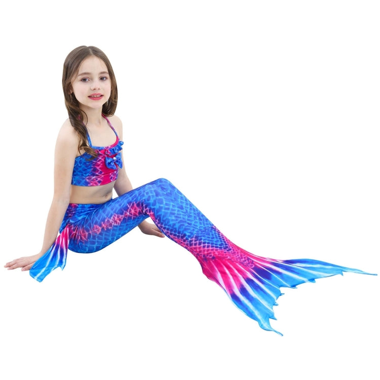 Children's mermaid tail swimsuit with blue and pink scaled fin, posing on hands