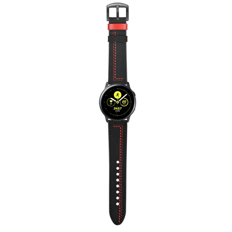 Black leather watch strap with red stitching and buckle, on a round smartwatch