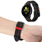 Black leather watch strap with red stitching worn on a wrist over a smartwatch