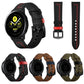 Assorted leather watch straps: black with red, brown with blue, and green with blue stitching
