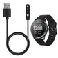 Magnetic charging cable connected to a black smartwatch