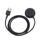 USB-A plug and black magnetic charging dock with coiled charging cable