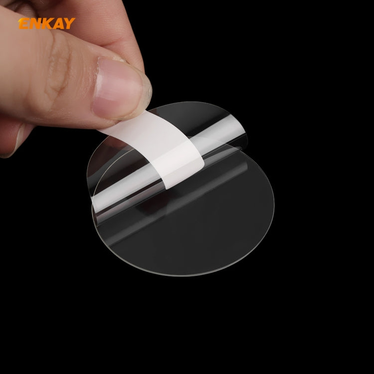 Hand holding curved tempered glass screen protector film for smartwatch screen