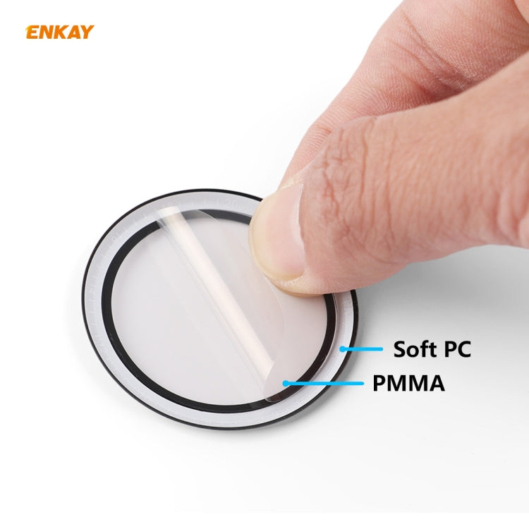 Hand holding round screen protector layers: Soft PC and PMMA