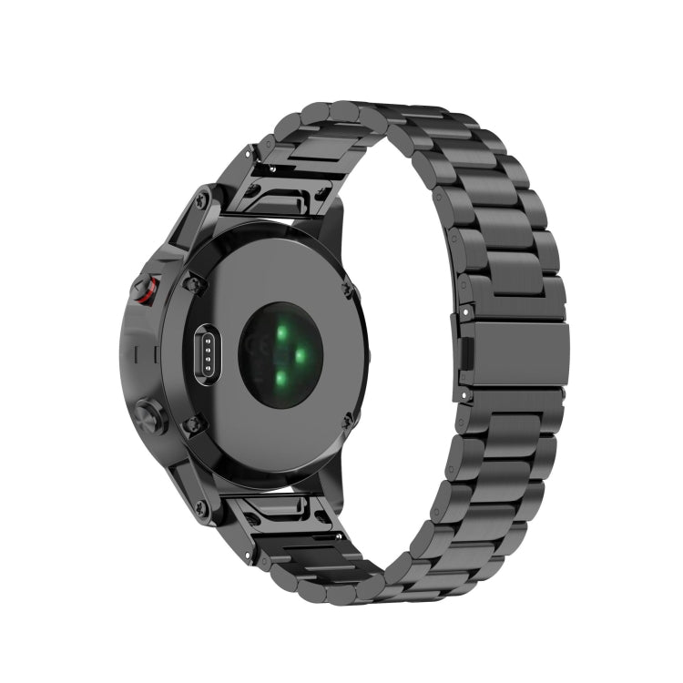 Stainless steel watch strap with black metal links and quick-release connector ends