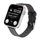Dark gray woven nylon watch strap with metal buckle and loop holes.