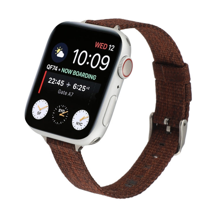 Brown woven nylon watch strap with metal buckle and adjustable holes.