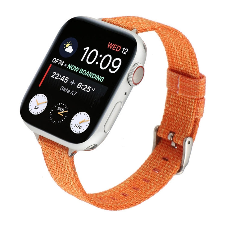 Orange woven nylon watch strap with metal buckle and adjustable holes.