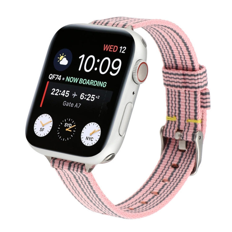 Pink striped woven nylon watch strap with metal buckle and adjustable holes.