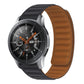 Silicone magnetic watch strap in dark blue with matching brown underside.