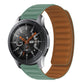 Silicone watch strap, green-teal top with orange-brown underside; smartwatch face visible