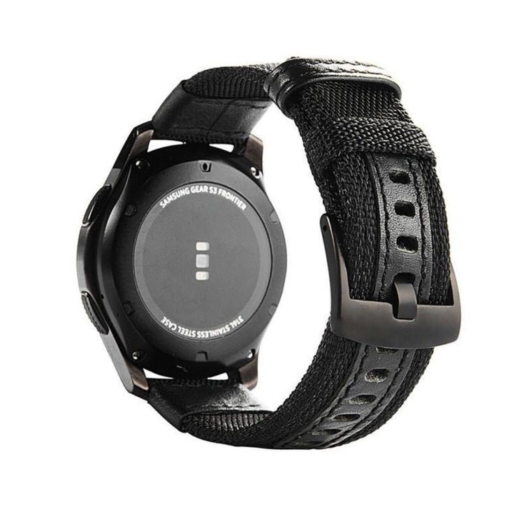 Black canvas watch strap with textured weave, black keeper strap, and metal buckle