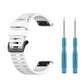 White silicone sports watch strap with spring bar tools and adjustable buckle.