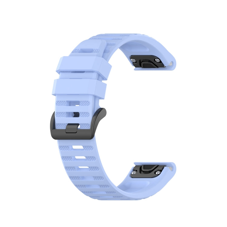 Light blue silicone sports watch strap with perforated band and adjustable buckle.
