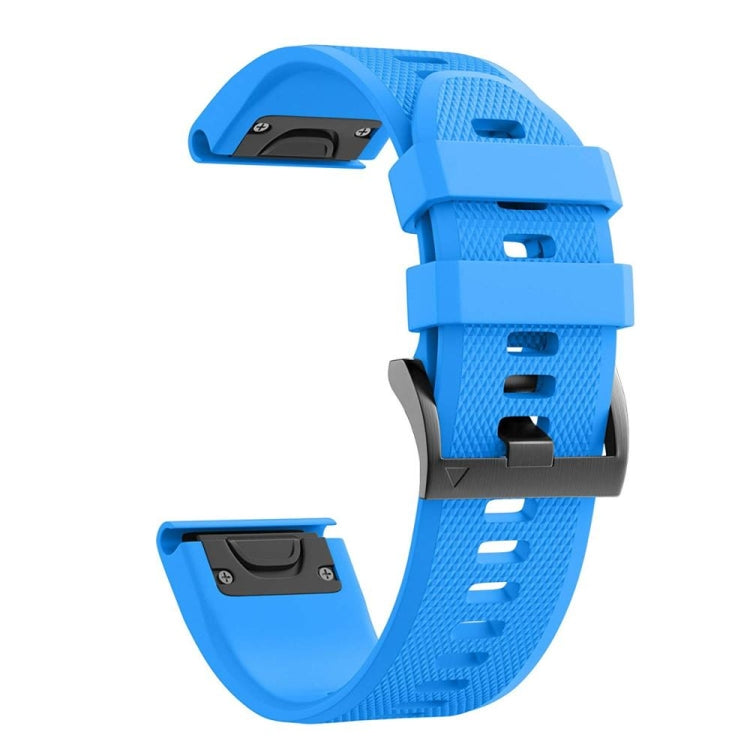 Sky blue silicone watch strap with perforated pattern and buckle clasp.