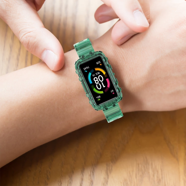 Green transparent silicone smartwatch band worn on wrist with fitness watch screen