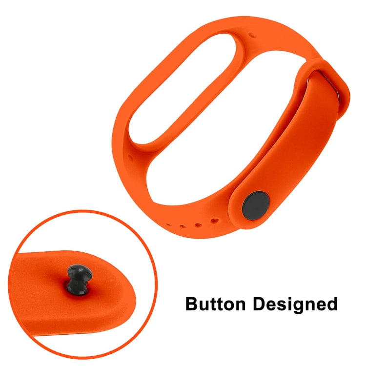 Orange TPU watch band close-up with button detail and strap holes