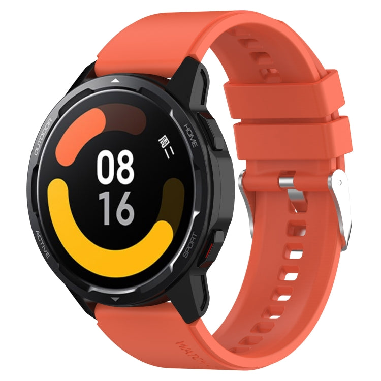 Orange silicone watch strap with silver buckle and clasp for smartwatch.