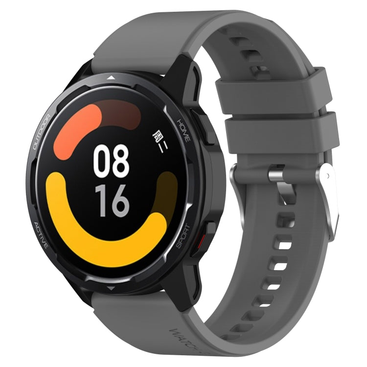 Gray silicone watch strap with silver buckle and clasp for smartwatch.