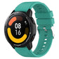 Teal silicone smartwatch strap with protruding head silver buckle; round watch face visible
