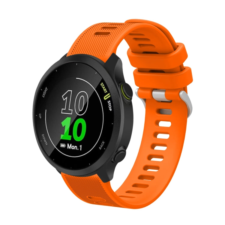 20mm silicone twill watch band, orange perforated strap with round smartwatch face.