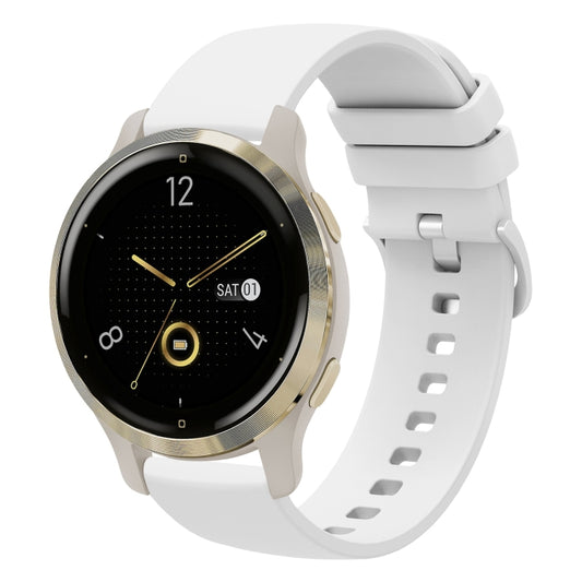White soft silicone watch band with perforated strap and clasp on a round smartwatch.