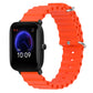 Orange silicone watch band with perforated links and metal pin clasp