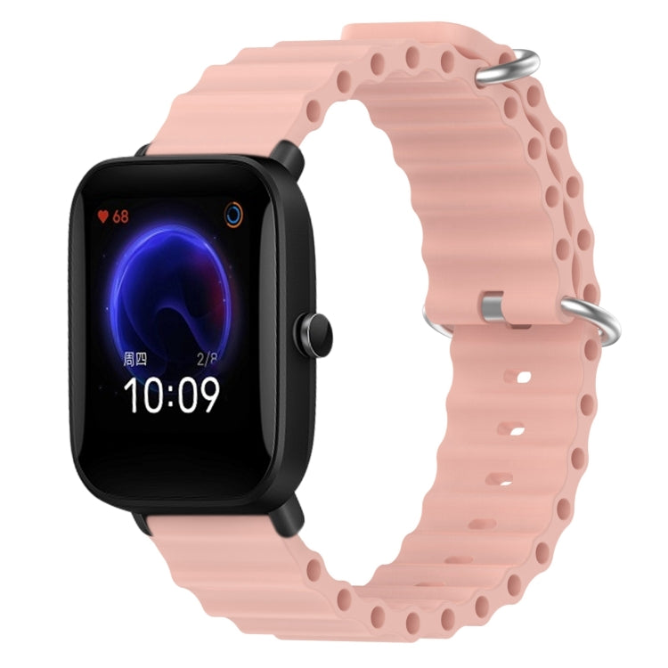 Pink silicone watch band with perforated links and metal pin clasp