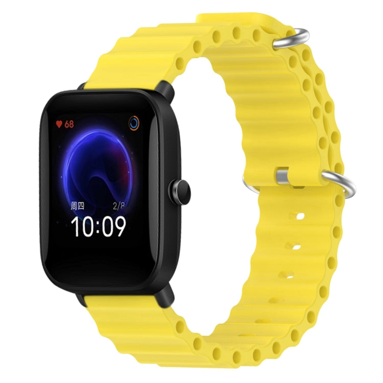 Yellow silicone watch band with perforated links and metal pin clasp