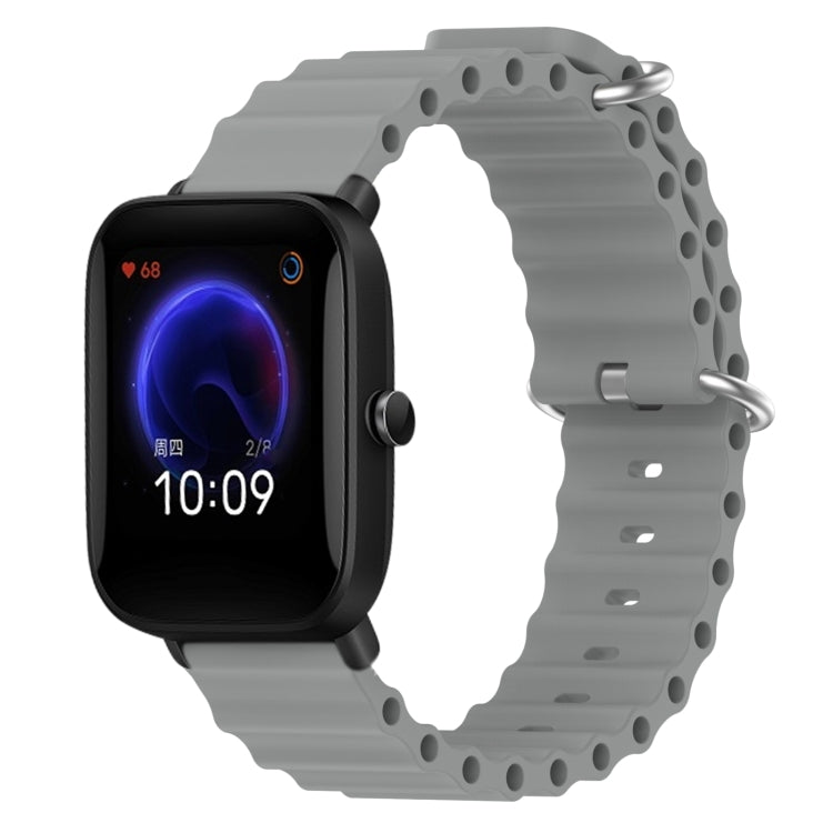 Gray silicone watch band with metal pin buckle and round link holes, for fitness watch
