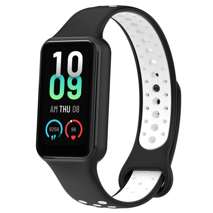 Two-tone silicone watch band in black and white with smartwatch display visible.