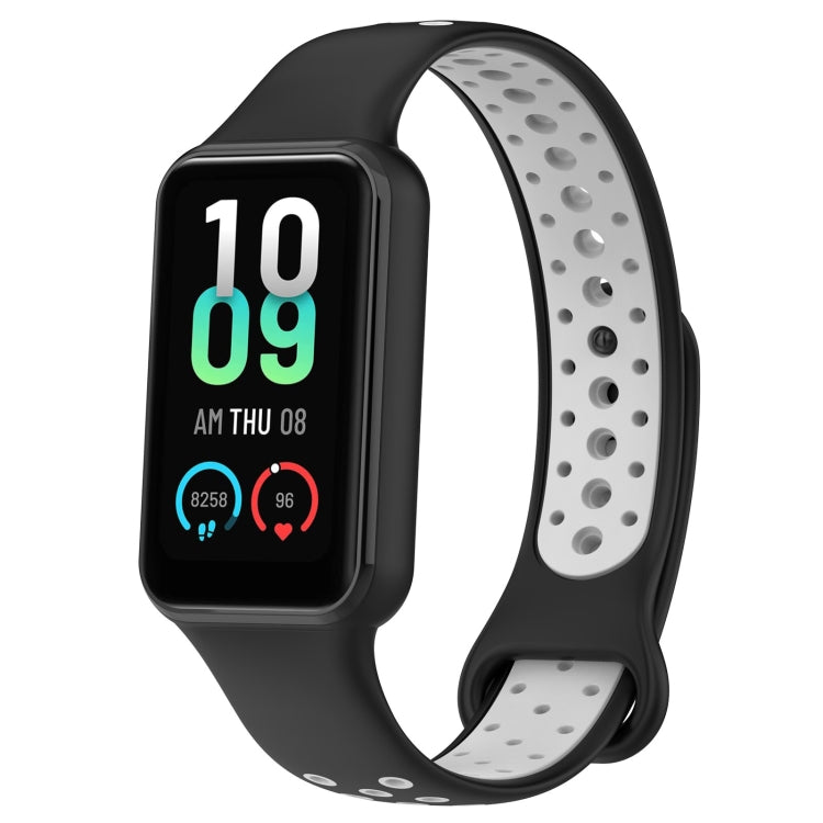 Two-tone silicone watch band in black and white with smartwatch display visible.