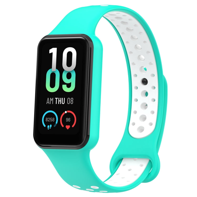Two-tone silicone watch band in teal and white with smartwatch display visible.