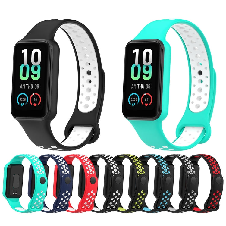 Multiple colors of silicone watch bands laid out, with perforated two-tone straps.