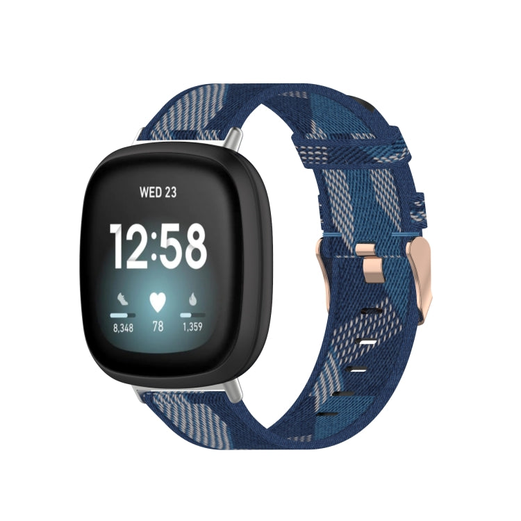 Nylon weave watch band in blue plaid pattern with metal pin and keeper