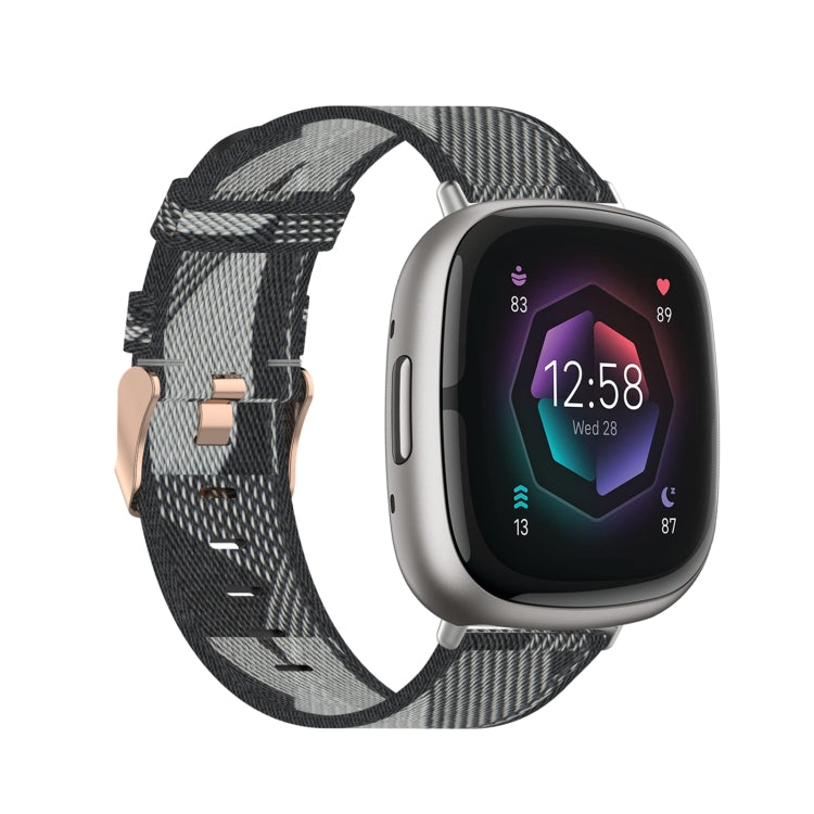 Nylon weave watch band in gray and black plaid pattern with rose-gold buckle