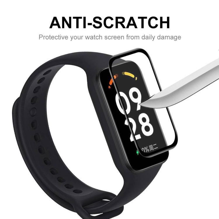 Anti-scratch full-coverage screen protector film on smartwatch display, with blade test