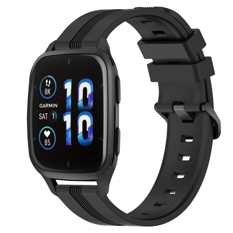 Concave striped silicone watch band in black with buckle, worn on a black smartwatch