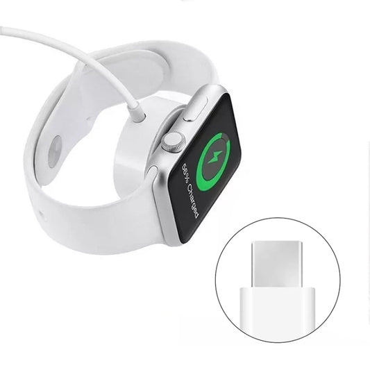 Magnetic charger puck attached to a white smartwatch with charging cable
