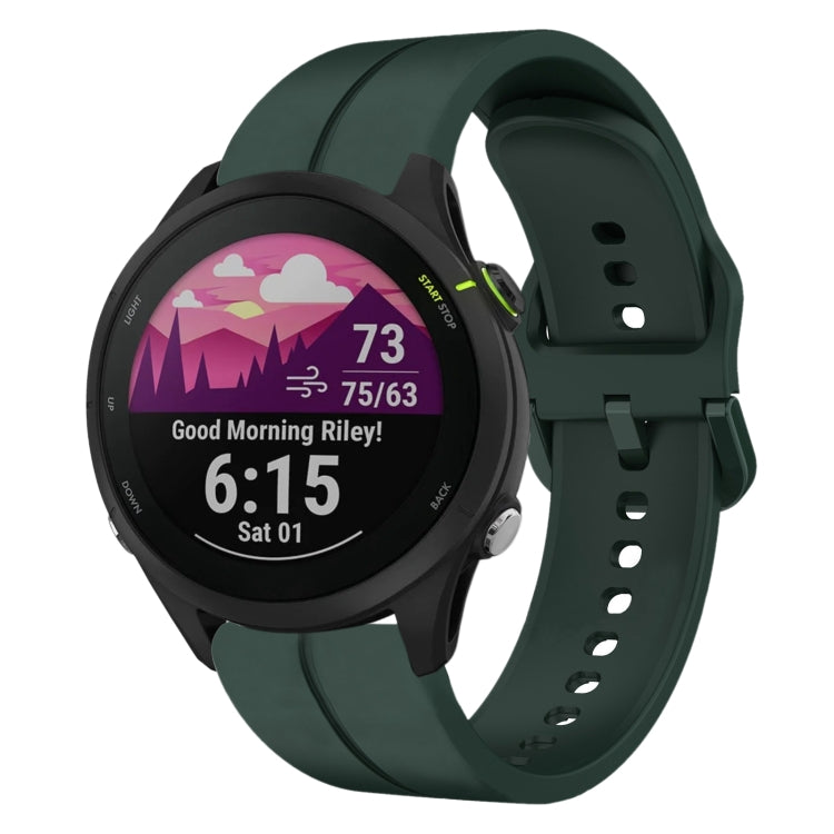 Dark green silicone watch strap with loop buckle holes and clasp, smartwatch attached