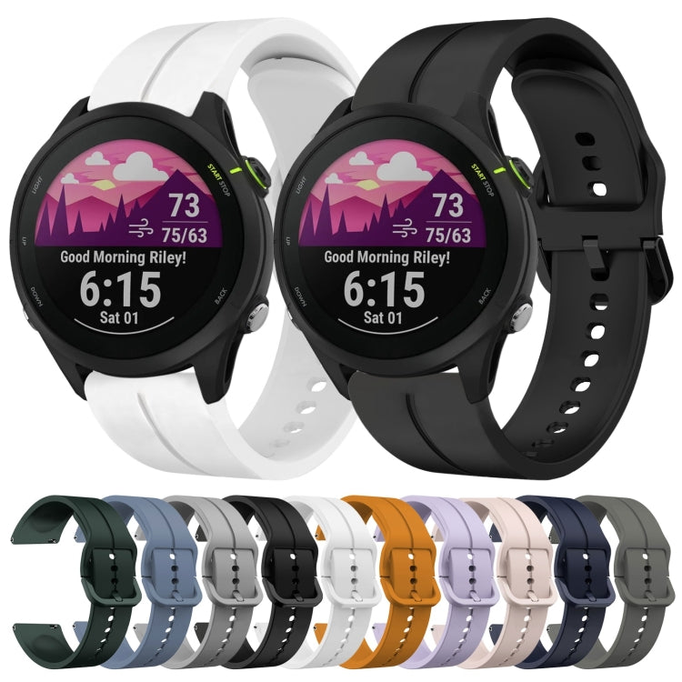Set of silicone loop watch bands showing white and black straps with pin-buckle clasp