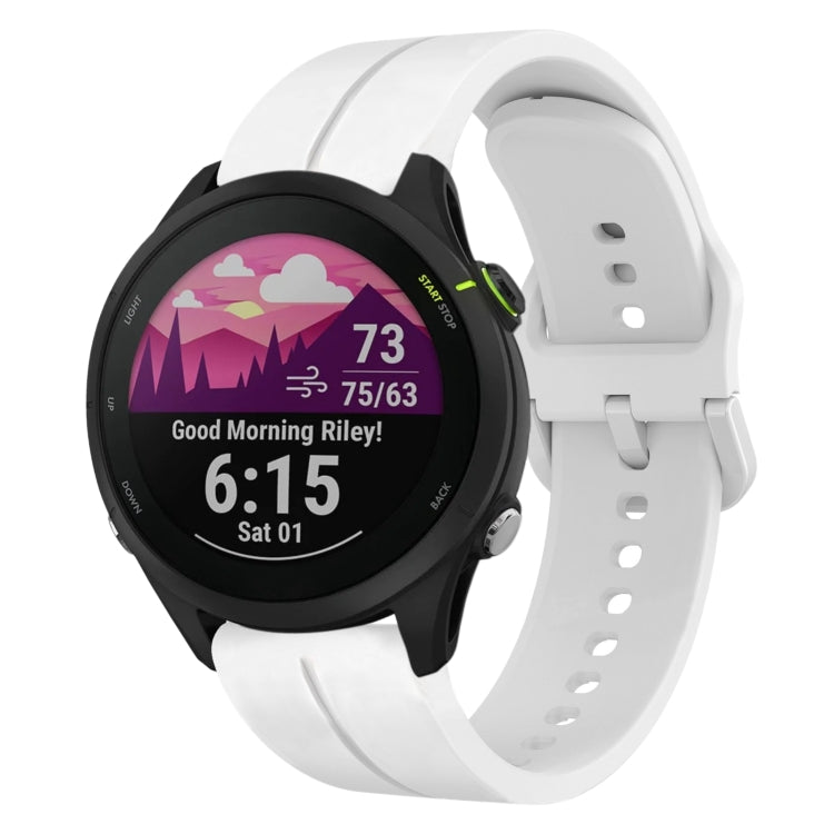 White silicone loop watch band with watch attached, perforated strap holes.