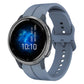 Light blue silicone watch band with multiple holes and round metal watch case