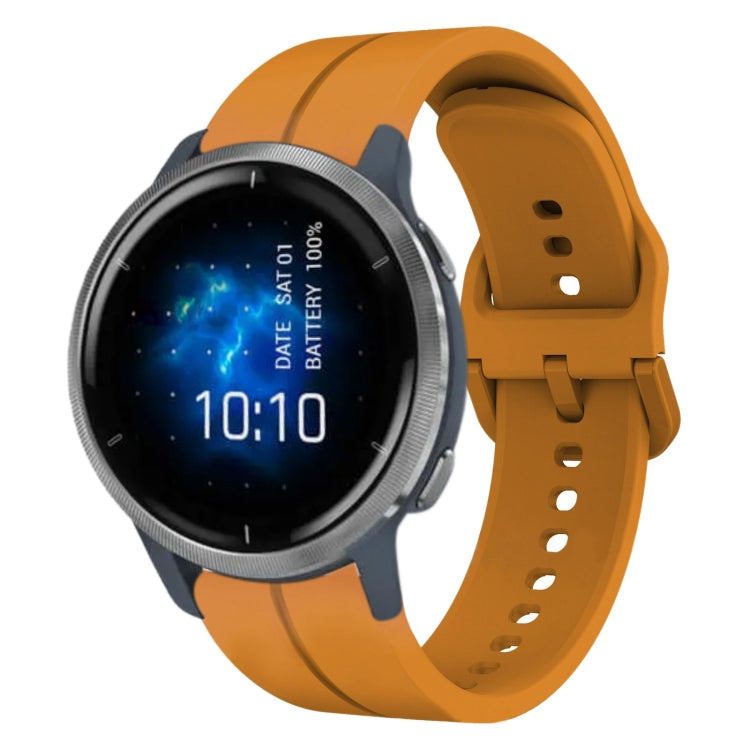 Blue silicone watch band with perforations and clasp, attached to a smartwatch