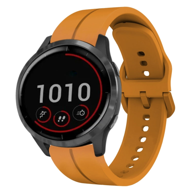 Dark green silicone watch band with perforations and clasp, smartwatch shown on wrist